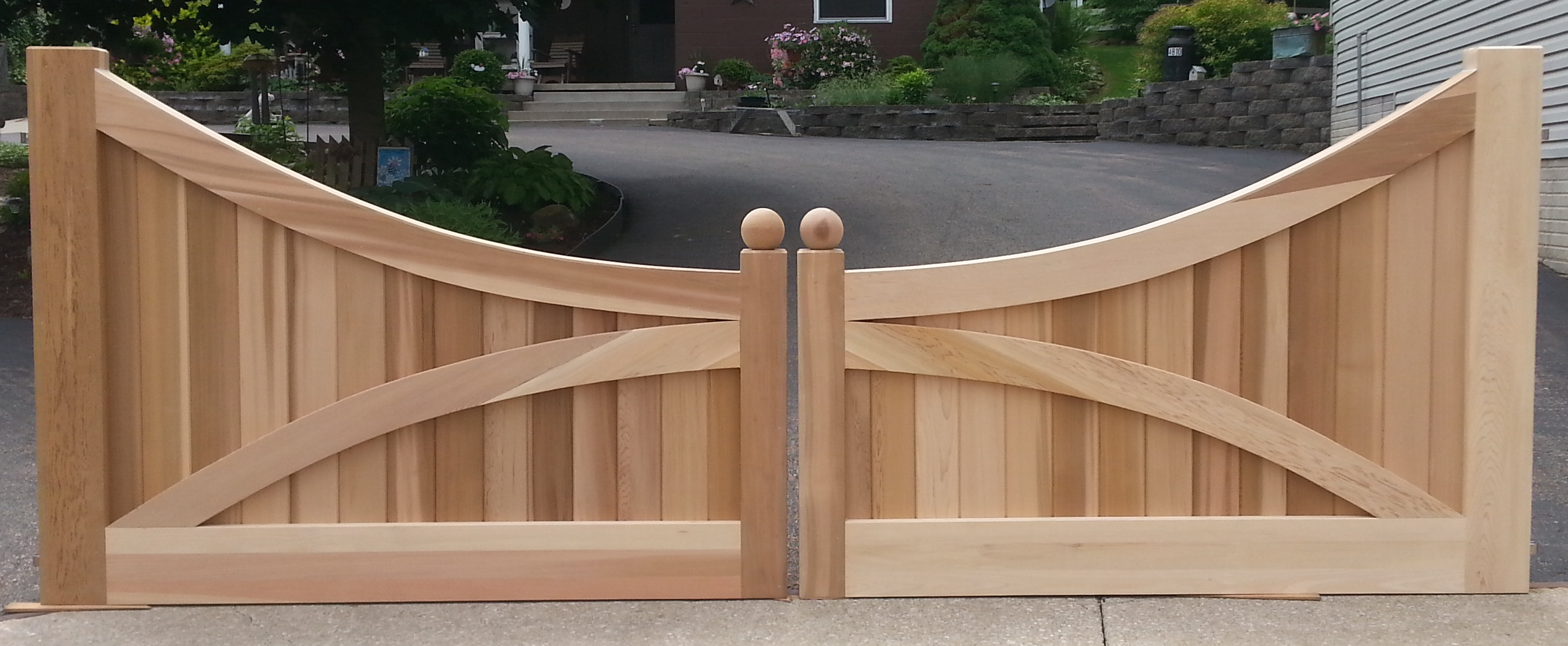 Custom driveway gates made out of Western Red Cedar New England Woodworks