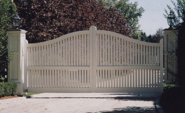 Montauk Convex wooden driveway gate with AZEK roof.