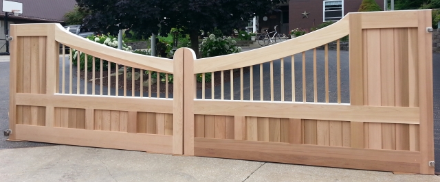 Custom Concave wooden driveway gate with AZEK "roof".